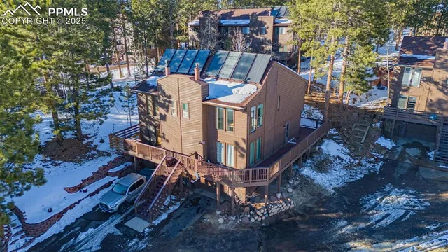 a view of roof deck with patio and outdoor seating
