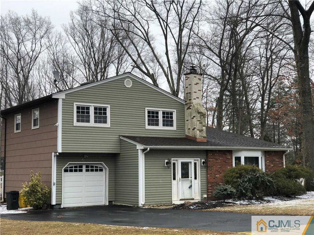 14 Timber Road East Brunswick, NJ 08816 - Photo 1 of 10 a front view of a house with a yard