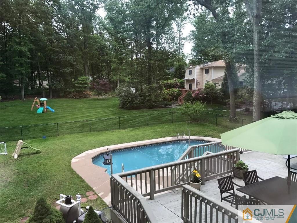 14 Timber Road East Brunswick, NJ 08816 - Photo 3 of 10 a view of a fountain and a slide