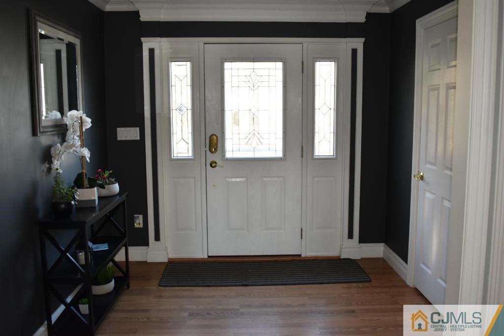 14 Timber Road East Brunswick, NJ 08816 - Photo 4 of 10 a view of an entryway with wooden floor