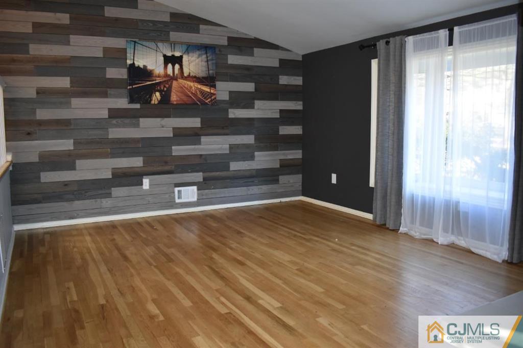 14 Timber Road East Brunswick, NJ 08816 - Photo 6 of 10 a view of empty room with wooden floor