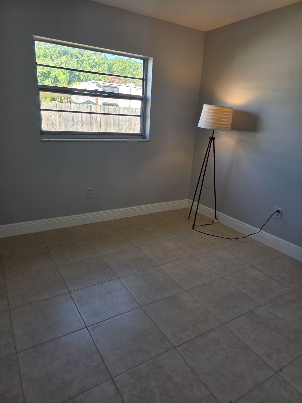 3386 Rudolph Road Lake Worth Beach, FL 33461 - Photo 19 of 25 a view of an empty room with a window