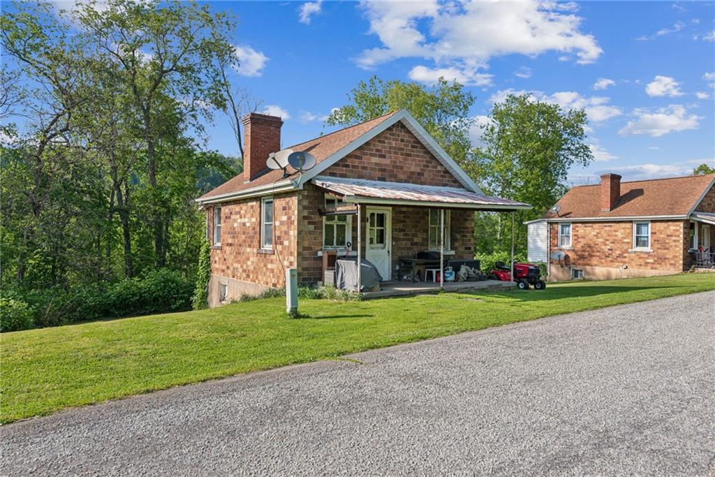 375 Reduction Road Smithton, PA 15479 - Photo 23 of 30 a front view of a house with a yard