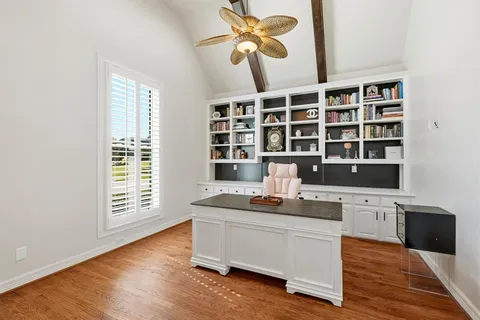 a workspace with furniture window and wooden floor