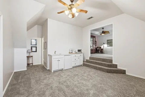 a spacious bedroom with two beds and a fireplace