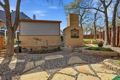 a view of a house with a yard porch and sitting area