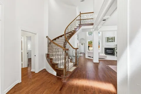 a view of entryway with wooden floor