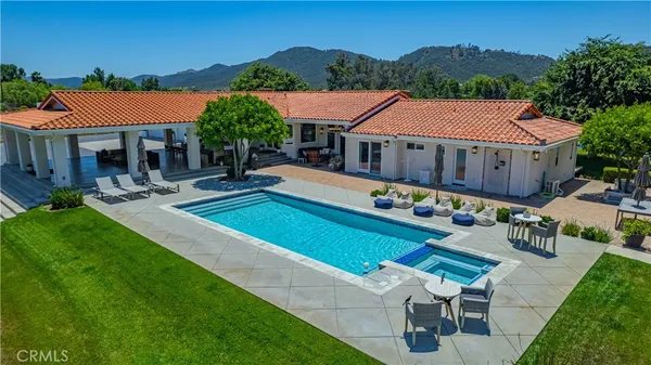 a view of a swimming pool with an outdoor space
