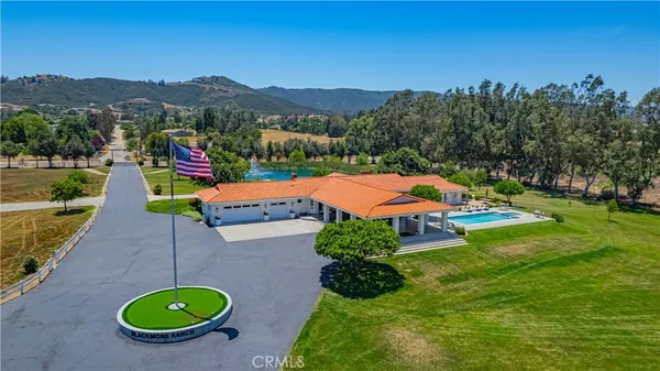 a view of a swimming pool with a lounge chair