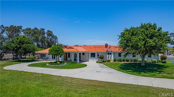 an aerial view of a house with a swimming pool