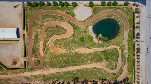 an aerial view of a house with a lake view