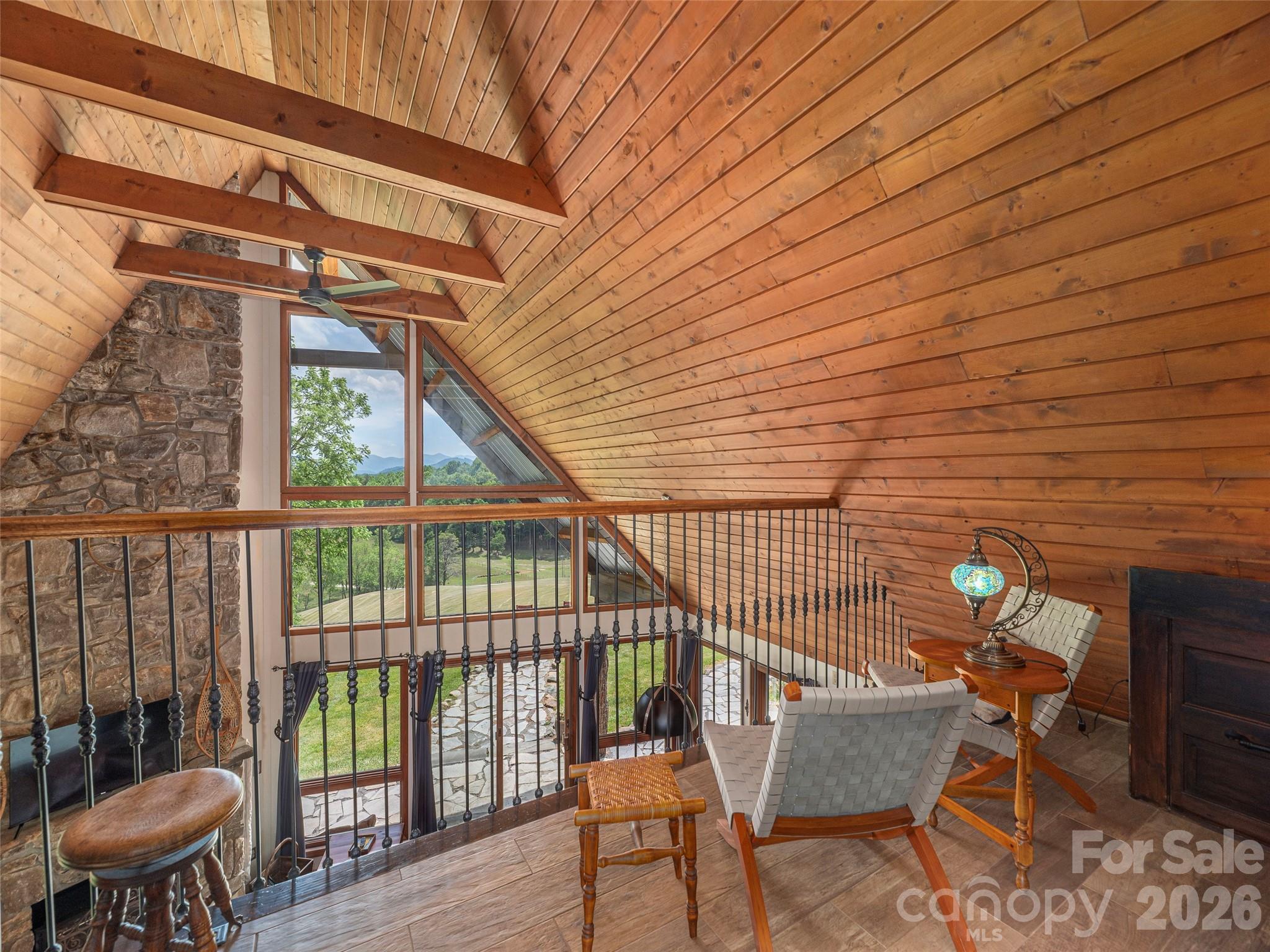 461 Ferguson Cove Loop Clyde, NC 28721 - Photo 27 of 46 a view of a chairs and table in the balcony
