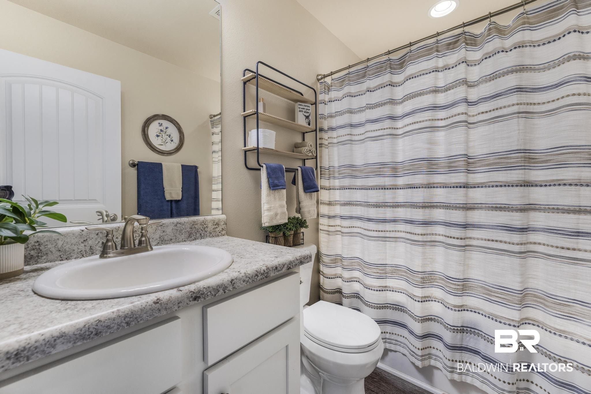 22043 Garland Loop Silverhill, AL 36576 - Photo 27 of 41 Full bath featuring vanity and shower / bath combination with curtain