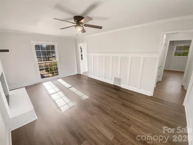 a view of empty room with windows