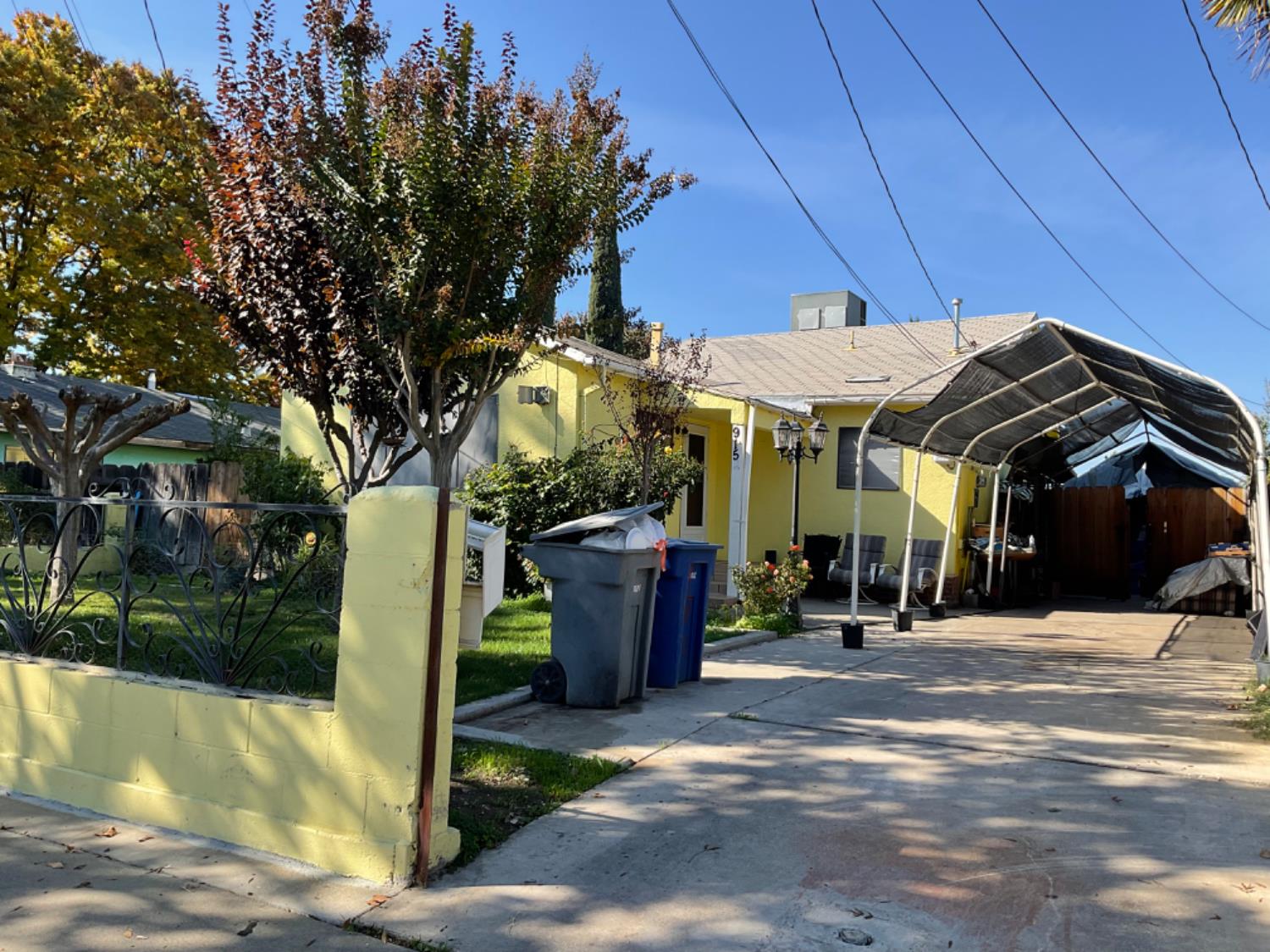 915 R Street Merced, CA 95341 - Photo 12 of 44 a view of a patio with a table and chairs under an umbrella