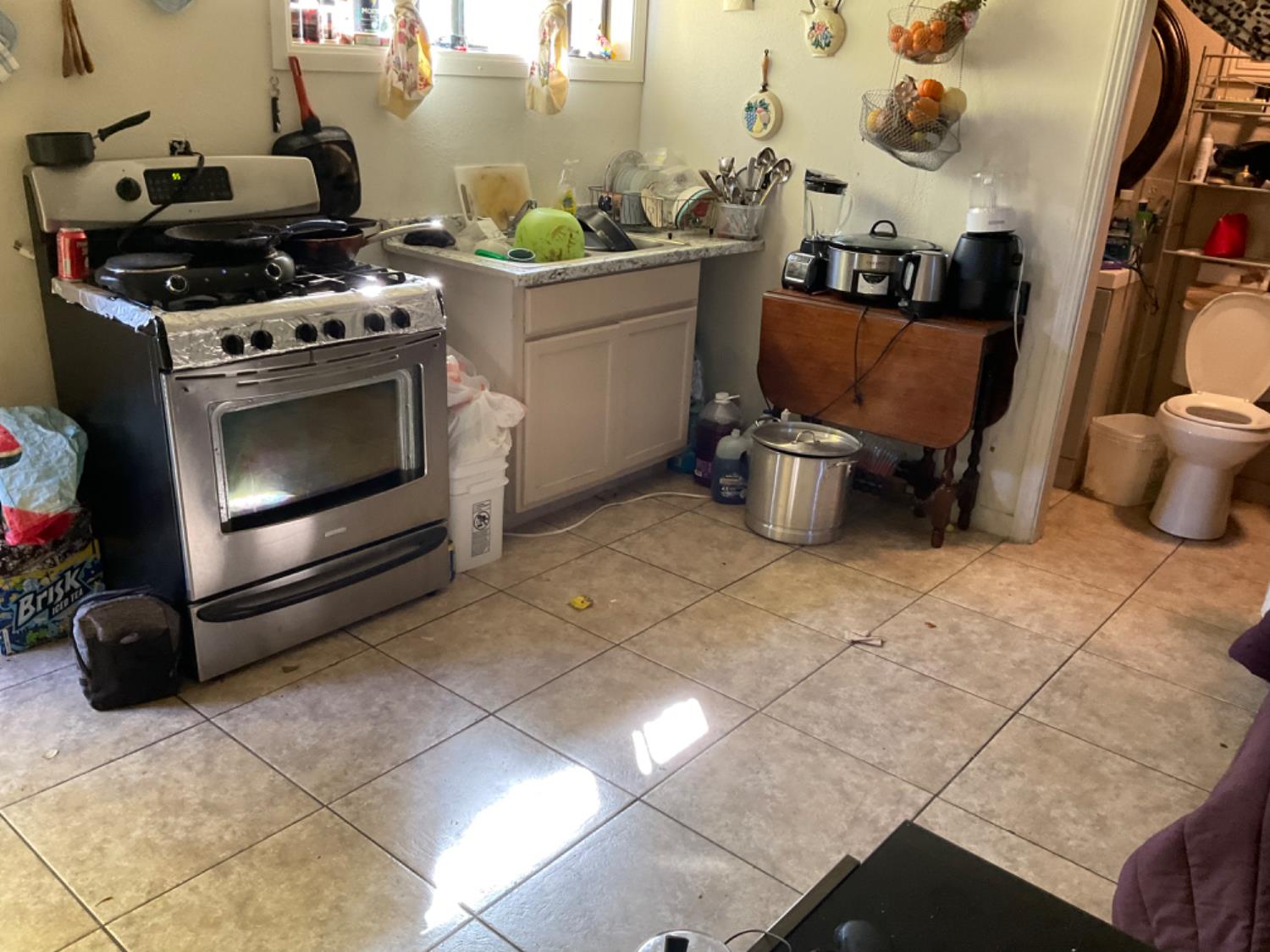 915 R Street Merced, CA 95341 - Photo 44 of 44 a kitchen with a stove and a cabinet