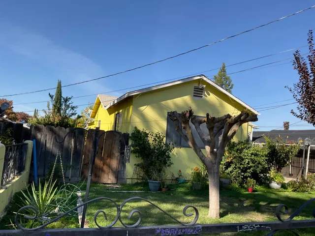 a view of a house with a small yard