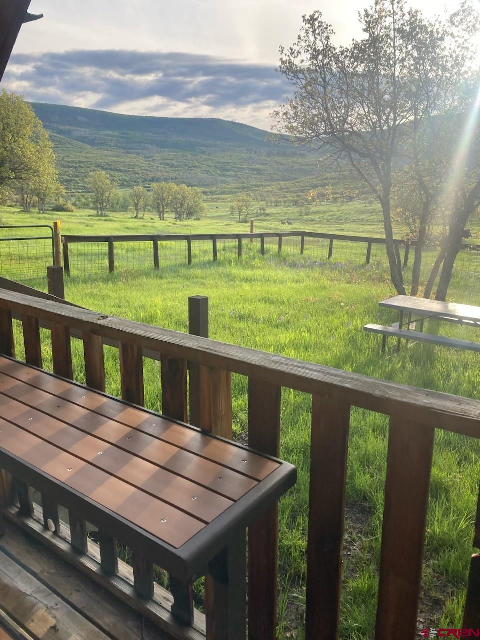 a view of a balcony with an ocean