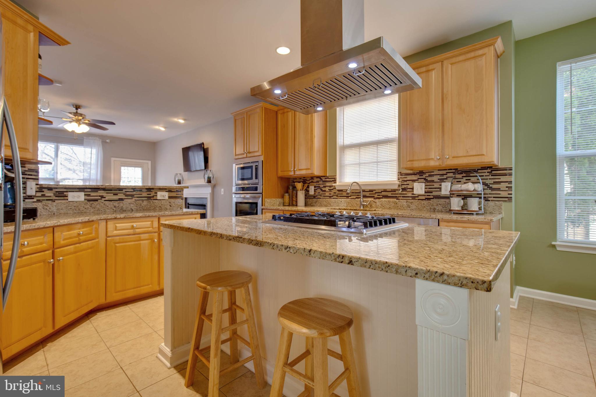 8371 Tillett Loop Manassas, VA 20110 - Photo 13 of 35 Island with Overhead Exhaust Hood