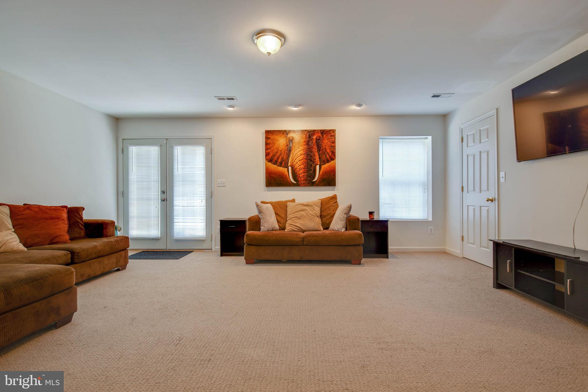 8371 Tillett Loop Manassas, VA 20110 - Photo 29 of 35 Large Family Room in Walk Out Basement