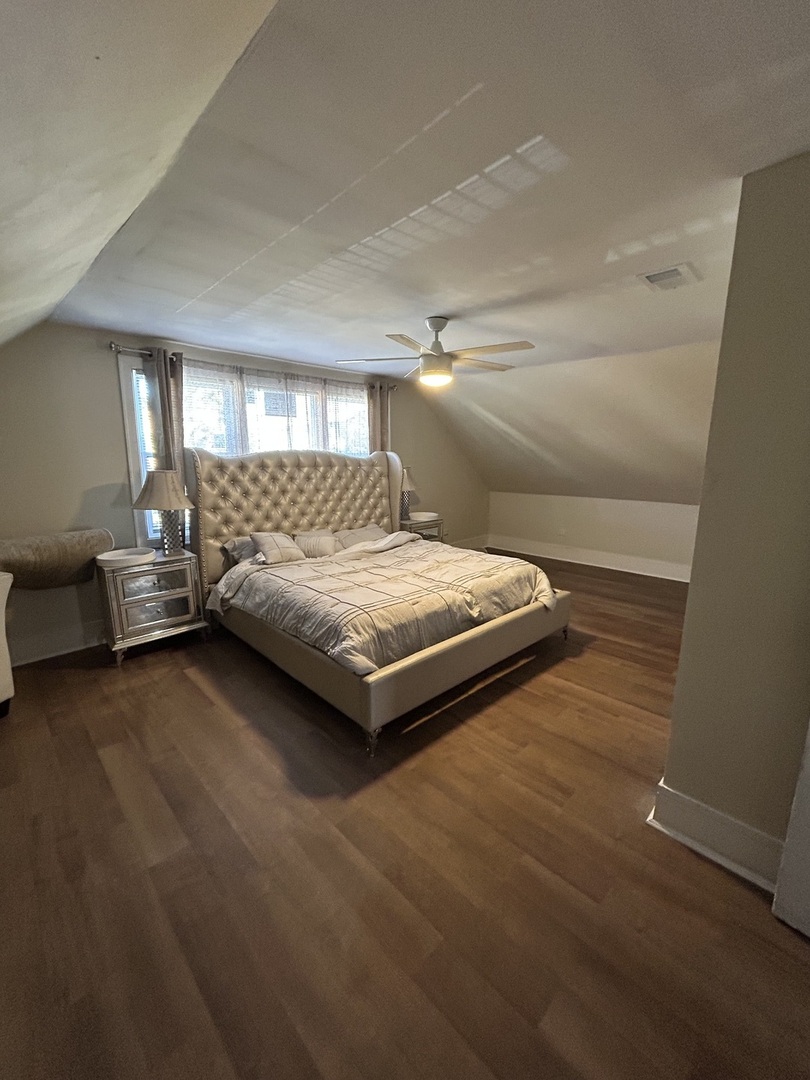 5915 West Iowa Street Chicago, IL 60651 - Photo 15 of 35 a bedroom with a bed and window