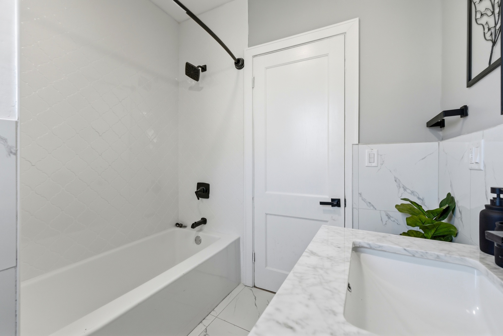 5915 West Iowa Street Chicago, IL 60651 - Photo 25 of 35 a bathroom with a bathtub and shower