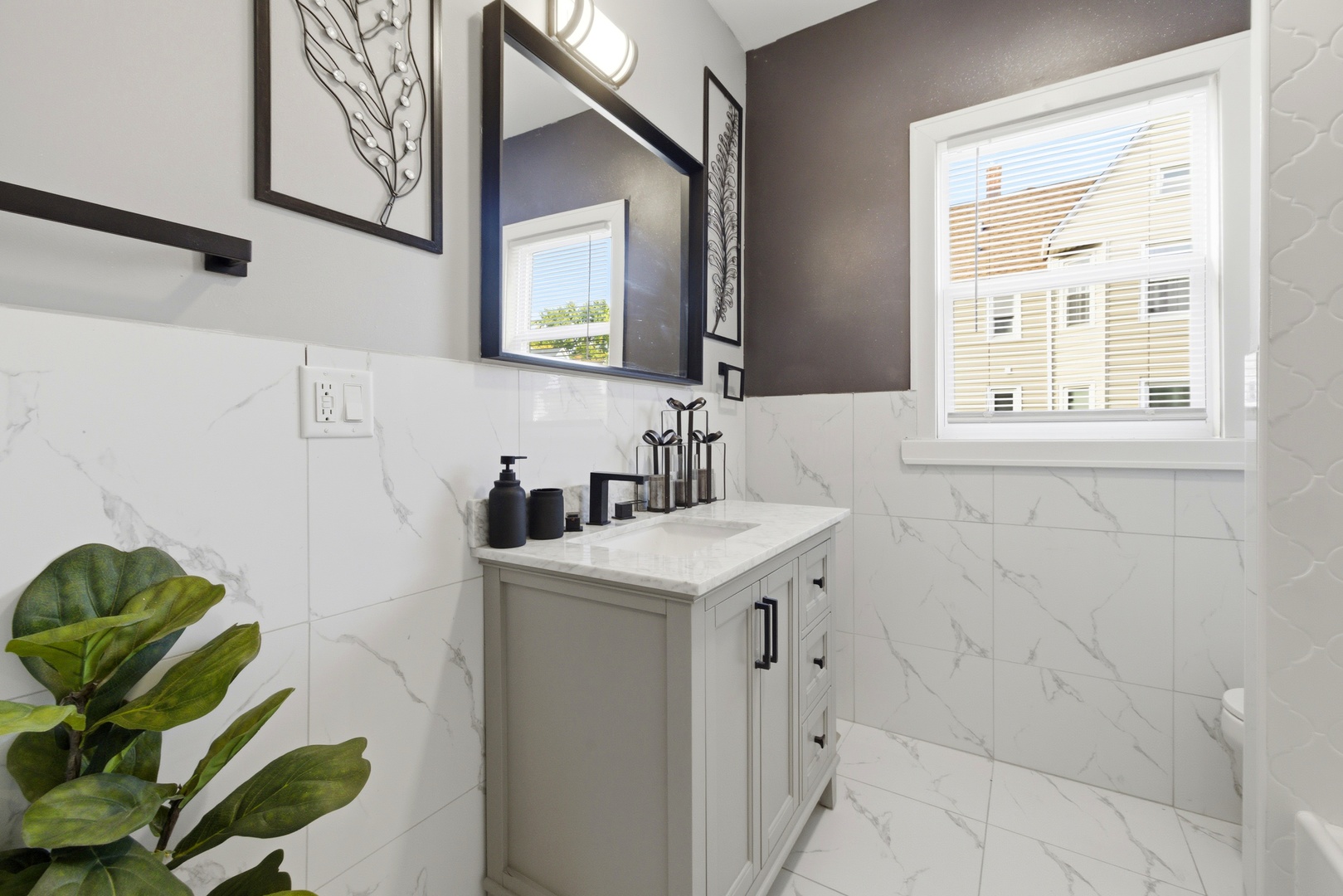 5915 West Iowa Street Chicago, IL 60651 - Photo 26 of 35 a bathroom with a sink a vanity and a mirror