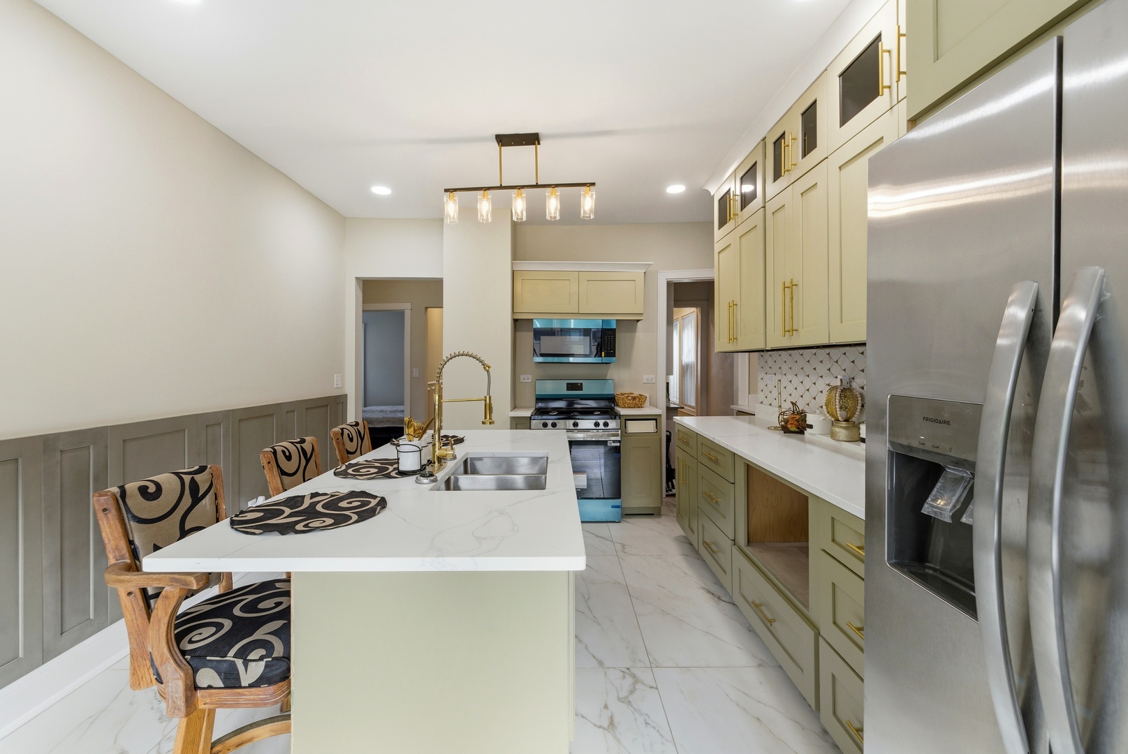 5915 West Iowa Street Chicago, IL 60651 - Photo 29 of 35 a kitchen with a sink appliances and cabinets