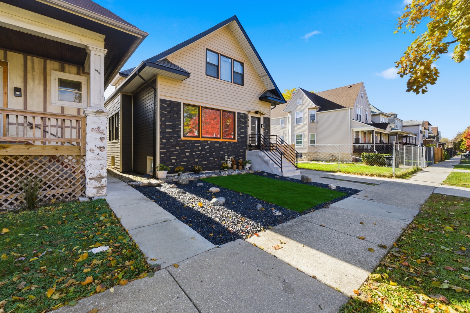 5915 West Iowa Street Chicago, IL 60651 - Photo 32 of 35 a front view of a house with garden