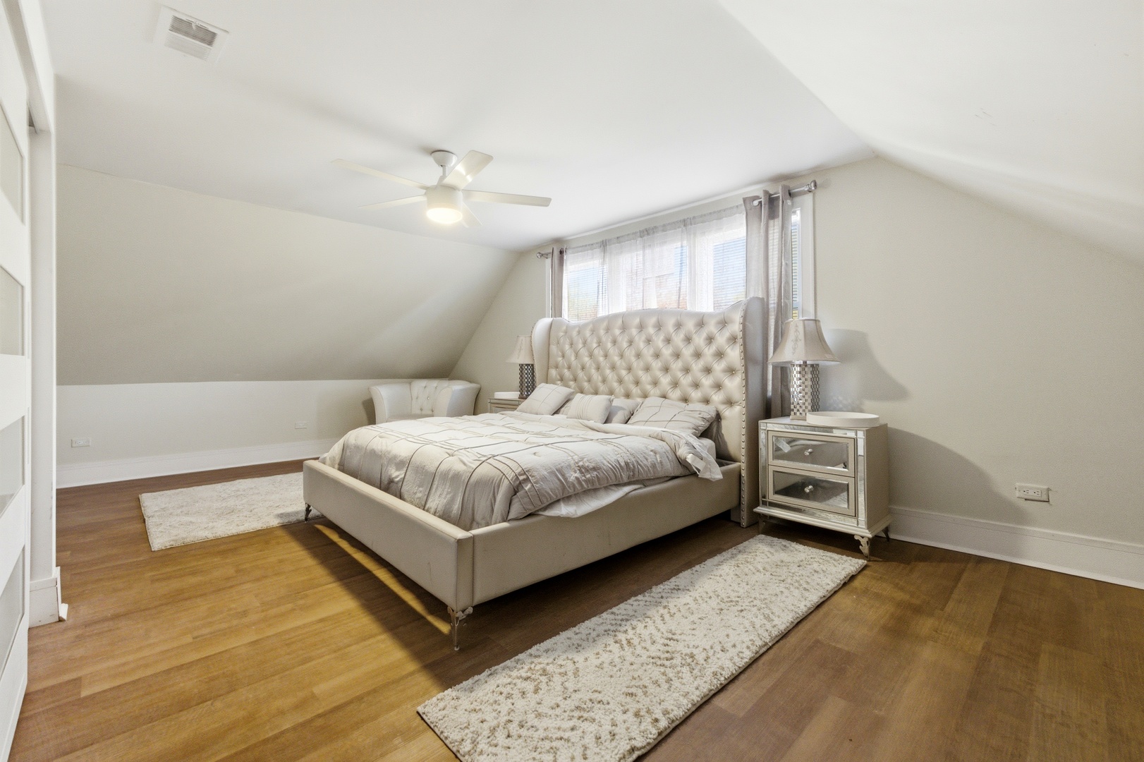 5915 West Iowa Street Chicago, IL 60651 - Photo 34 of 35 a bedroom with a bed and window