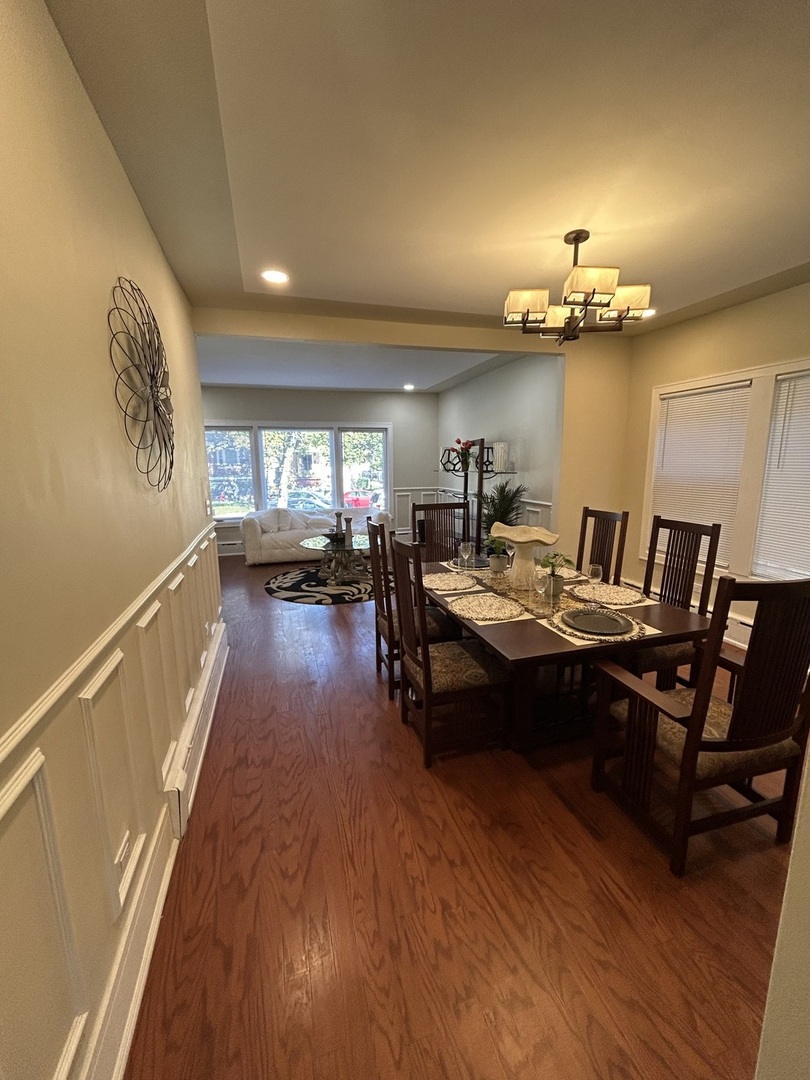 5915 West Iowa Street Chicago, IL 60651 - Photo 6 of 35 a living room with couch and a wooden floor
