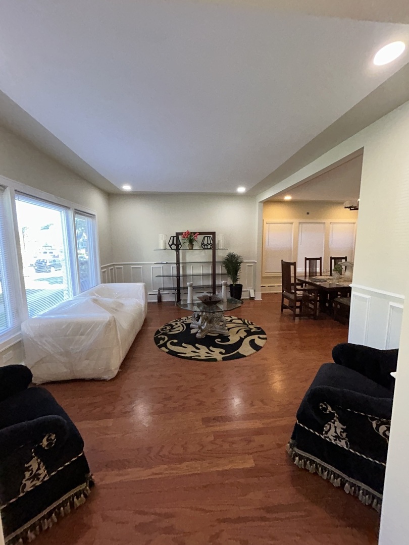 5915 West Iowa Street Chicago, IL 60651 - Photo 7 of 35 a bedroom with furniture and a mirror