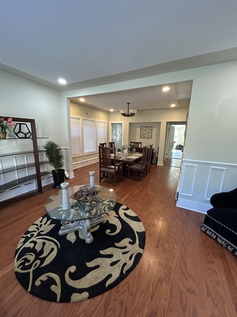 5915 West Iowa Street Chicago, IL 60651 - Photo 8 of 35 a living room with furniture and a wooden floor