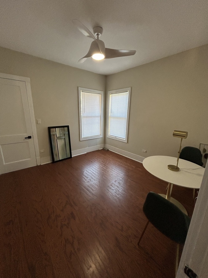 5915 West Iowa Street Chicago, IL 60651 - Photo 10 of 35 a view of a livingroom with furniture and hardwood floor