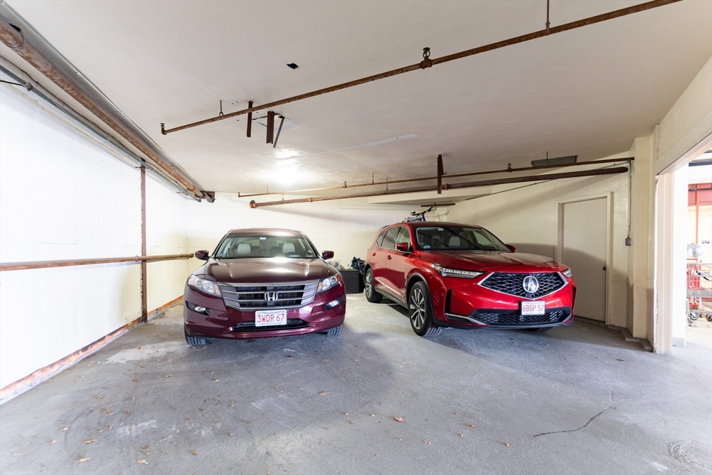 44 Elm Street, Unit 501 Worcester, MA 01609 - Photo 21 of 32 a car is parked in a garage