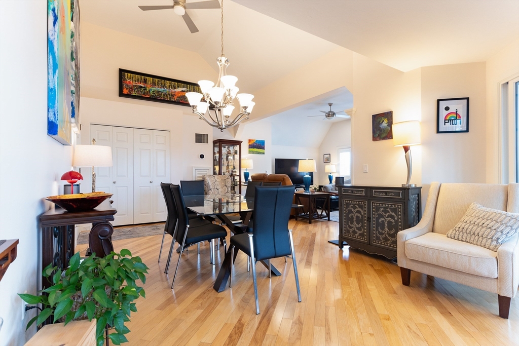 44 Elm Street, Unit 501 Worcester, MA 01609 - Photo 6 of 32 a view of a dining room with furniture and wooden floor
