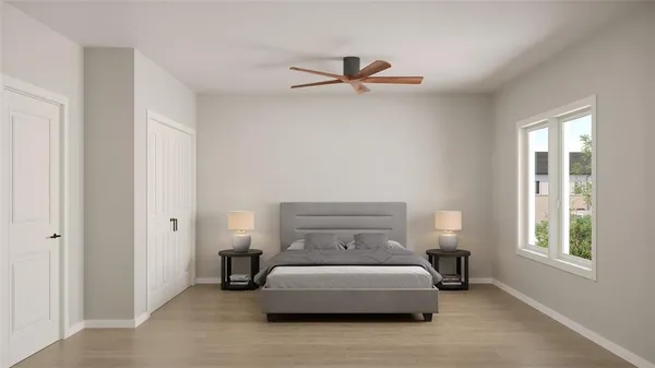 a bedroom with a bed and window