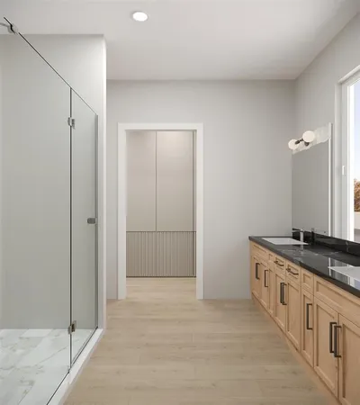 a bathroom with a granite countertop sink a mirror and a shower