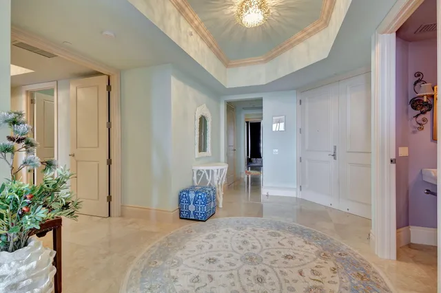 a living room with furniture plant and a window
