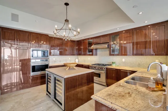 a bathroom with a sink a mirror and a toilet