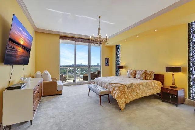 a balcony with furniture and city view