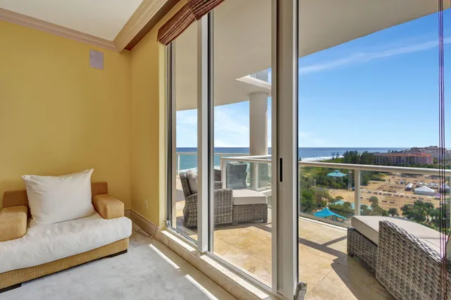 a bathroom with a tub a sink and a large mirror