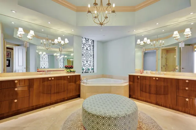 a spacious bathroom with a tub shower sink and mirror