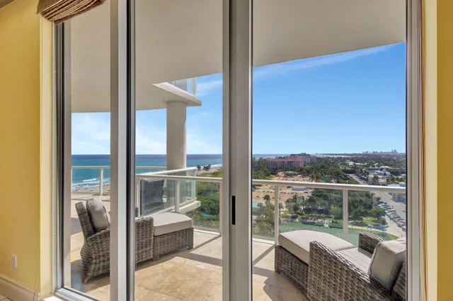 a bedroom with a large bed and a large window