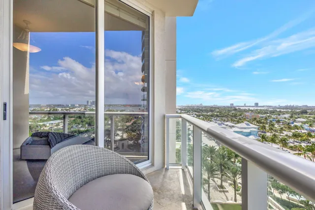 a view of a living room and balcony