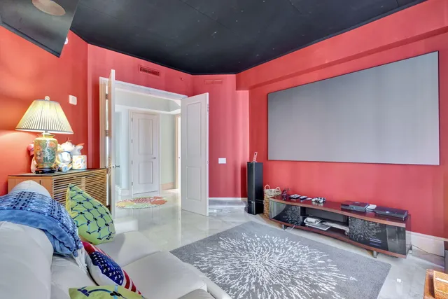 a view of a patio with table and chairs and potted plants