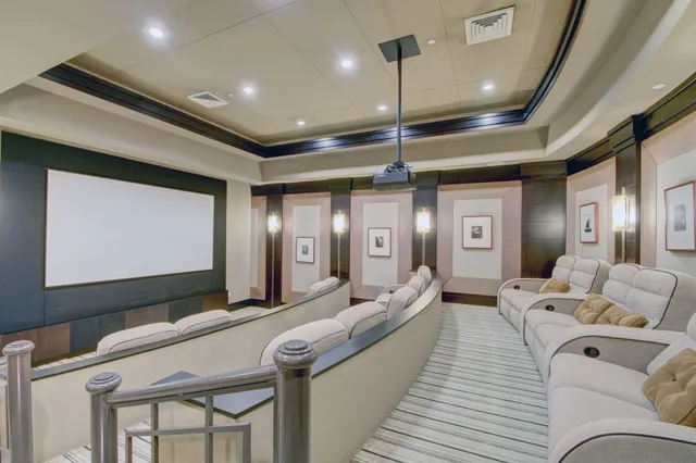 a living room with furniture and a ceiling fan