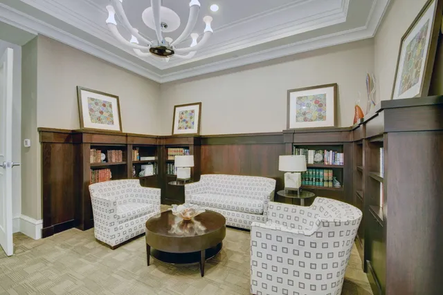 a dining room with wooden floor and furniture
