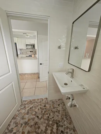 a bathroom with a sink and a mirror