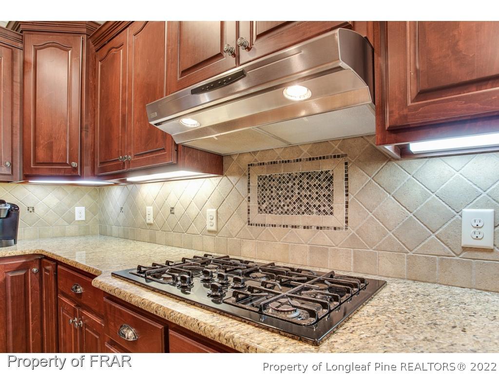 1517 Epic Way Hope Mills, NC 28348 - Photo 13 of 36 a kitchen with cabinets and appliances